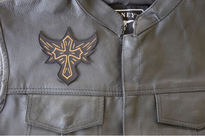 Christian Biker Cross Patch - 4x3.9 inch. Embroidered Iron on Patch shown on leather vest