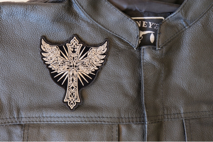 Christian Cross with Wings Patch - 3.8x4.2 inch - Embroidered Iron on Patch shown on leather vest