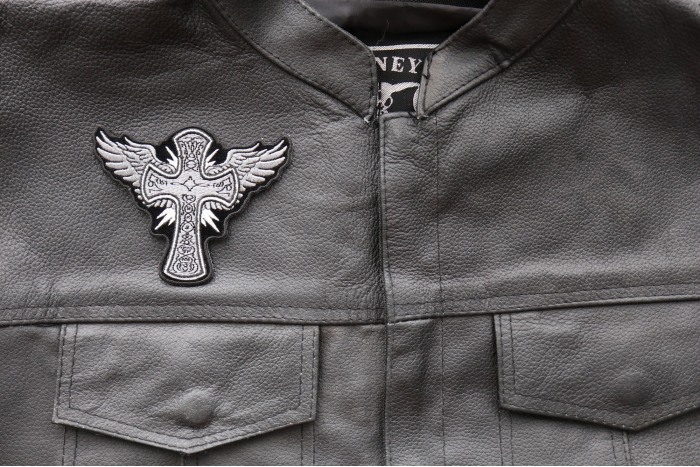 Cross with Wings Iron on Christian Patch - 4x3.2 inch - Embroidered Iron on Patch shown on leather vest