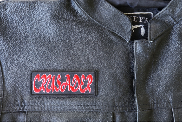 Crusader Patch - 4x1.5 inch - Embroidered Iron on Patch shown on leather vest