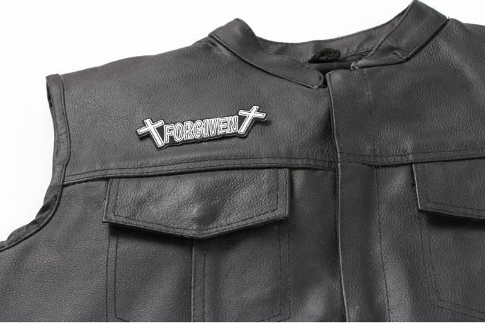FORGIVEN Patch - 4x1.25 inch. Embroidered Iron on Patch shown on leather vest