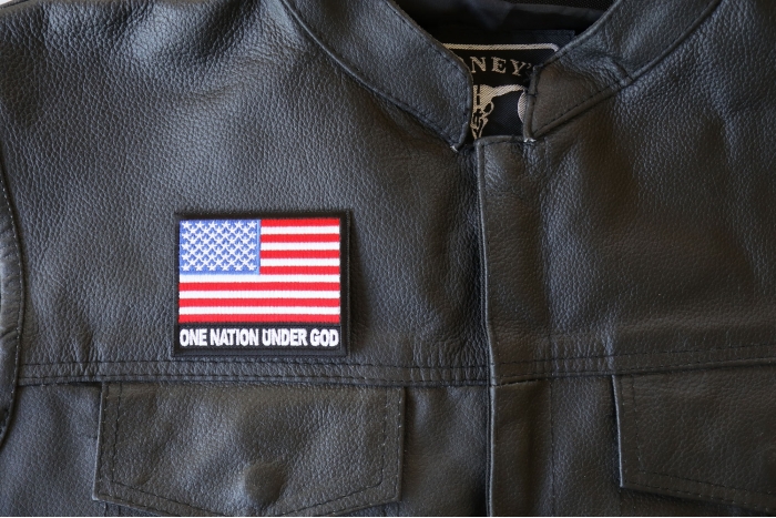 One Nation Under God American Flag Patch - 3x2.75 inch - Embroidered Iron on Patch shown on leather vest