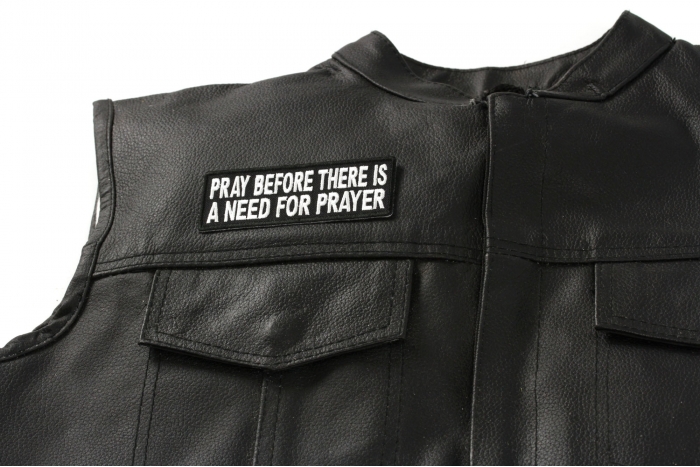 Pray Before Prayer Is Needed Patch - 4x1.5 inch. Embroidered Iron on Patch shown on leather vest