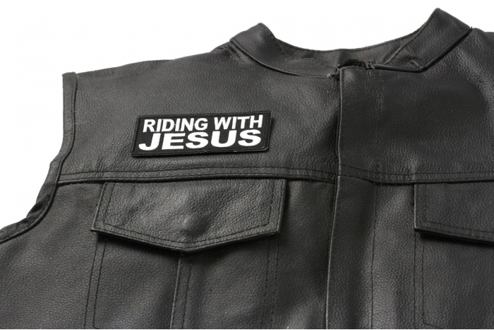 Riding with Jesus Patch - 4x1.5 inch. Embroidered Iron on Patch shown on leather vest