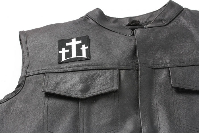 Three Crosses Patch - 2.25x2.5 inch. Embroidered Iron on Patch shown on leather vest