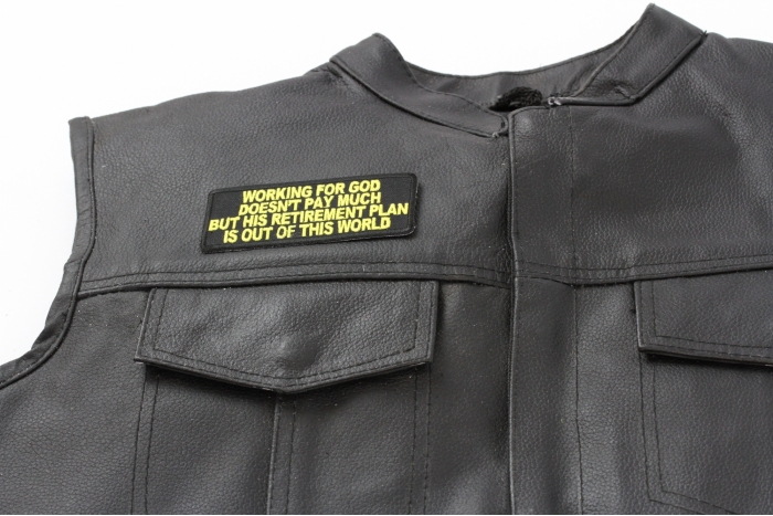 Working For God Doesn't Pay Much Patch - 4x1.75 inch. Embroidered Iron on Patch shown on leather vest