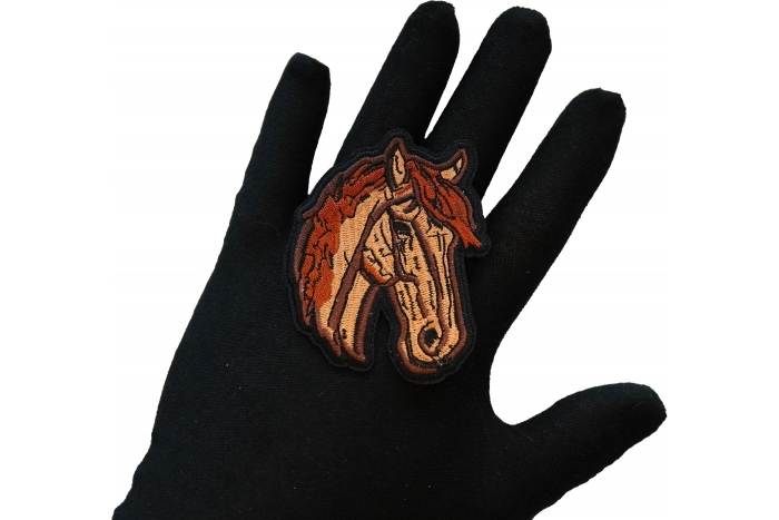 Horse Iron on Patch shown on hand for size comparison
