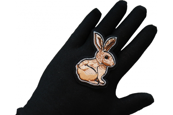 Rabbit Iron on Patch shown on hand for size comparison