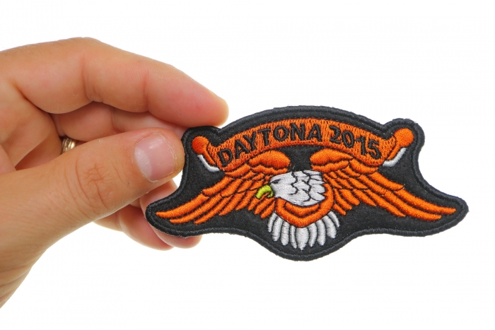 Daytona 2015 Orange Downwing Eagle Patch shown on hand for size comparison