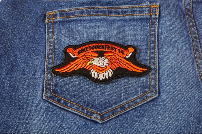 Biketoberfest 2014 Orange Downwing Eagle Biker Patch shown on jeans