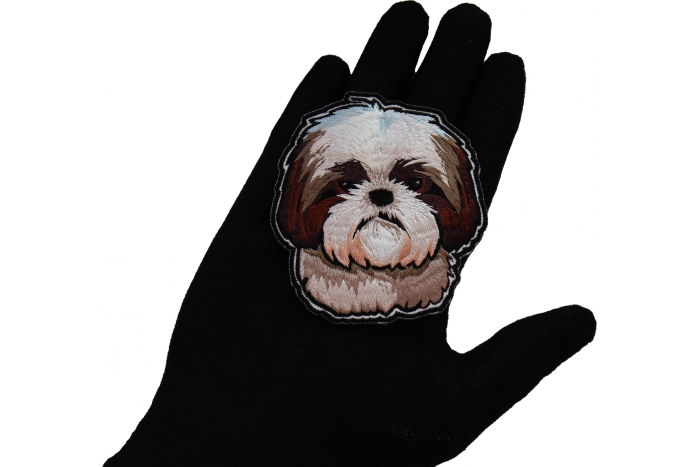 Shih Tzu Dog Patch shown on hand for size comparison