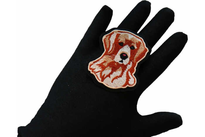 Handsome Retriever Dog Iron on Patch shown on hand for size comparison