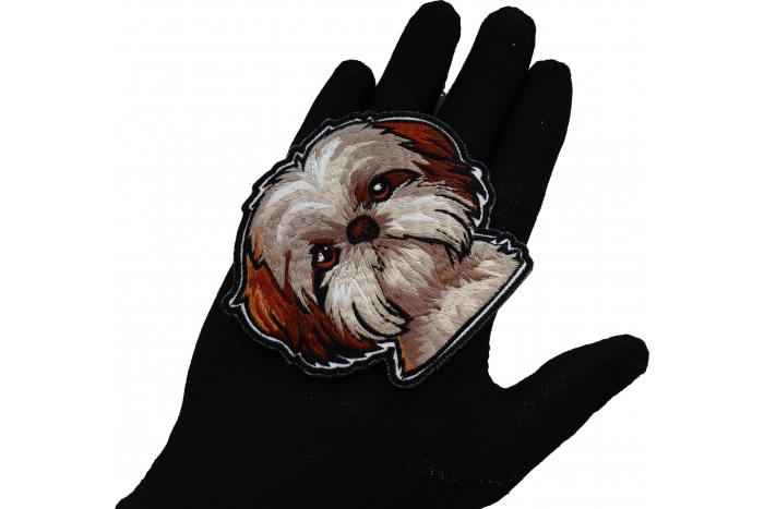 Shih Tzu Dog Patch shown on hand for size comparison