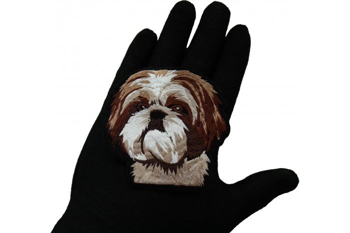 Shih Tzu Dog Patch shown on hand for size comparison