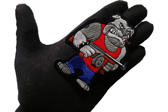Tommy Gun Bulldog Patch shown on hand for size comparison