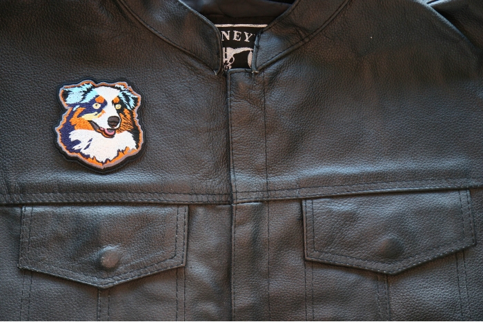 Proud Australian Shepherd Dog Iron on Patch shown on leather vest