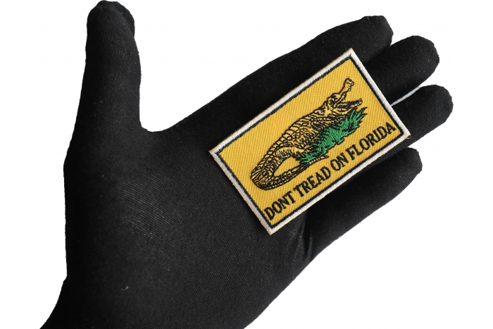 Don't tread on Florida Small Gadsden Flag Patch shown on hand for size comparison