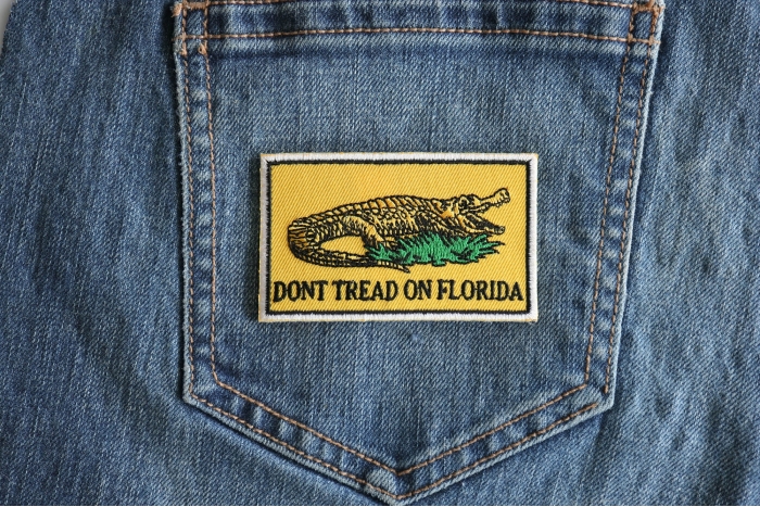 Don't tread on Florida Small Gadsden Flag Patch shown on jeans
