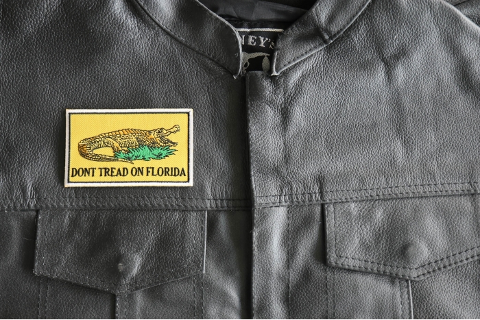 Don't tread on Florida Flag Patch - 4x2.3 inch - Embroidered Iron on Patch shown on leather vest