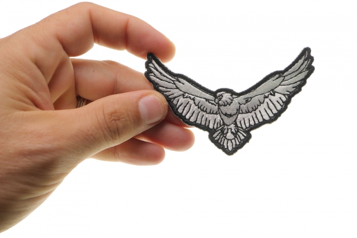 Black and White Eagle Iron on Patch shown on hand for size comparison