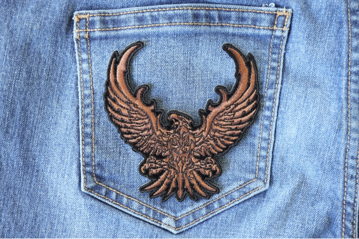 Brown Eagle Patch shown on jeans
