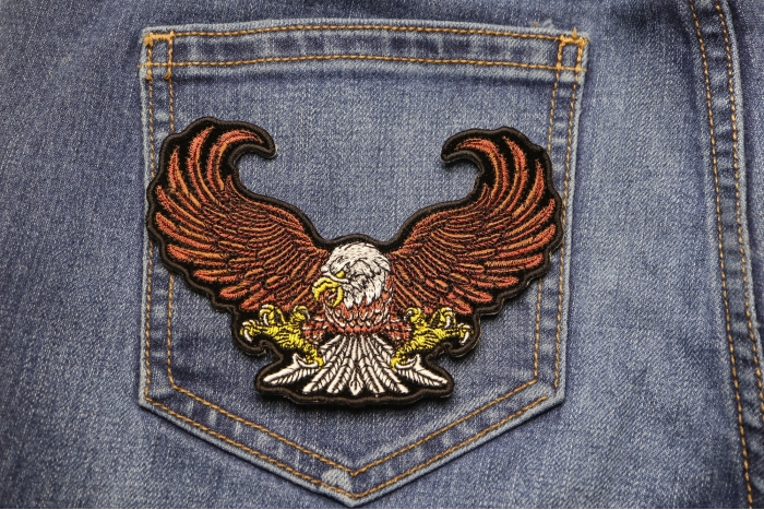 Brown Eagle Small Patch shown on jeans