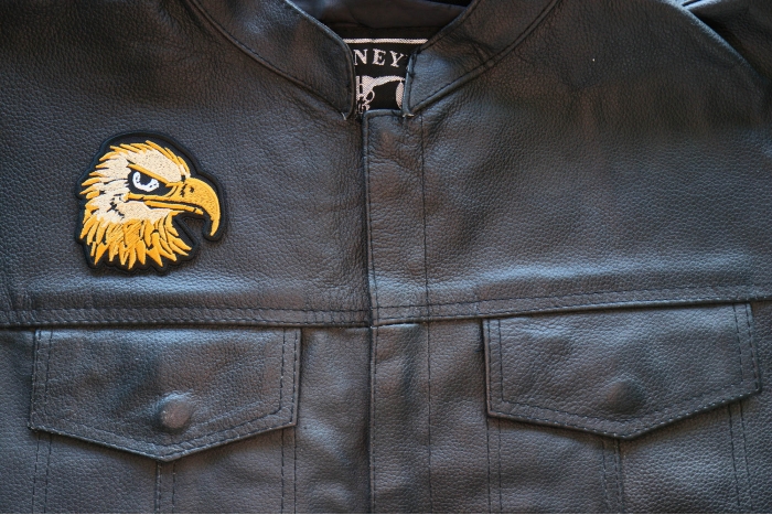 Eagle Head Iron on Patch shown on leather vest