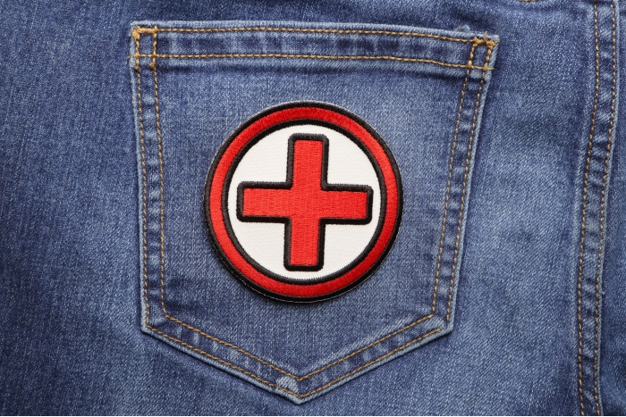 Red and Black Cross Medic Patch shown on jeans