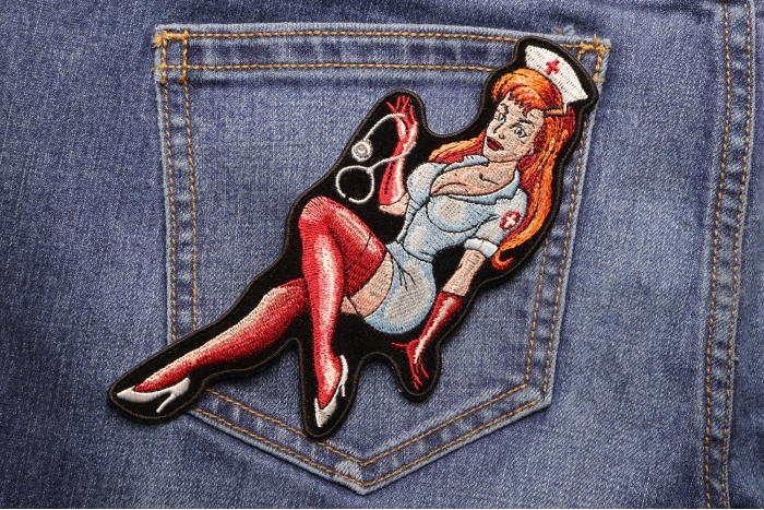 Sexy Red Head Nurse Embroidered Iron on Patch shown on jeans