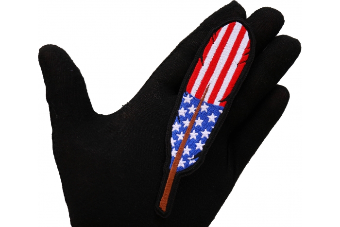 American Flag Feather Patch shown on hand for size comparison