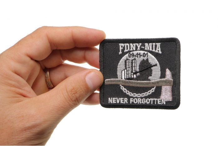 FDNY MIA Never Forgotten Iron on Patch shown on hand for size comparison