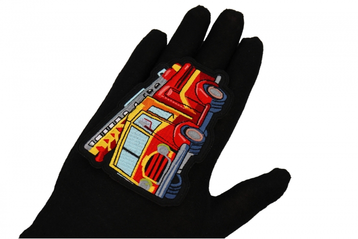Fire Truck Patch shown on hand for size comparison