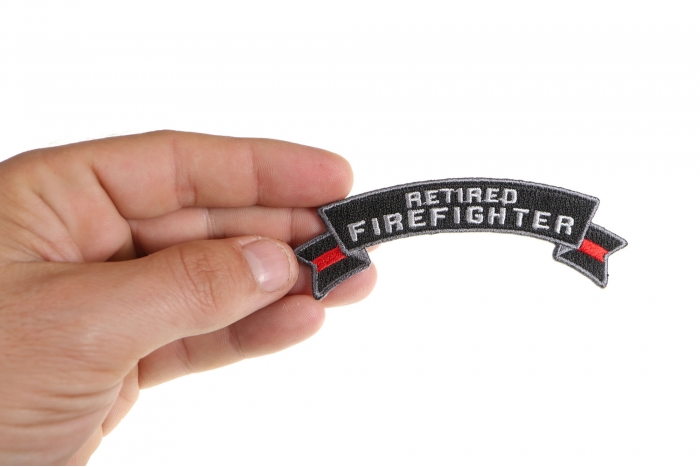 Retired Firefighter Rocker Patch shown on hand for size comparison