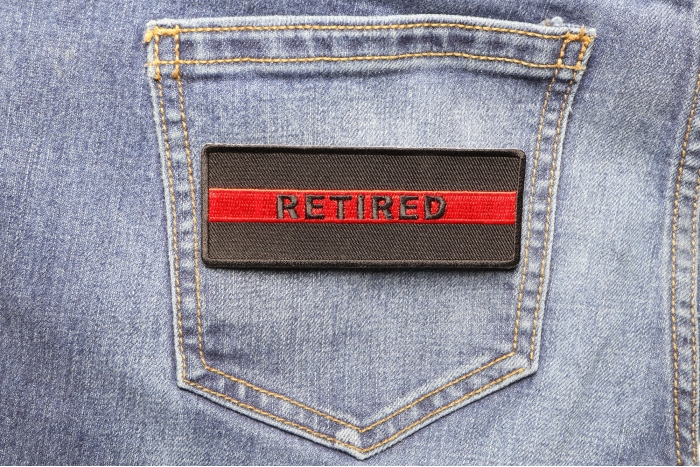 Retired Red Line Firefighter Patch shown on jeans