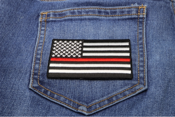 Subdued US Flag With Red Stripe Patch shown on jeans