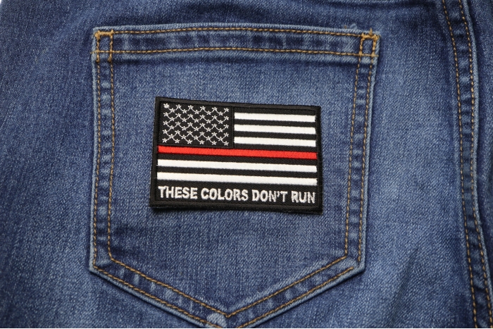 These Colors Don't Run Red Line US Flag Patch shown on jeans