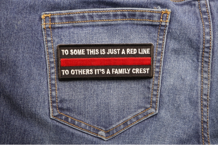 To Some This is Just a Red Line To Others It's a Family Crest Patch shown on jeans