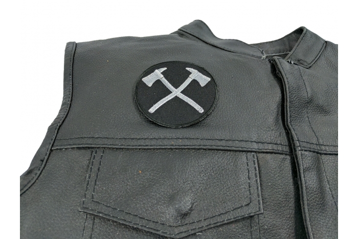Crossed Axes In Silver Patch - 3x3 inch. Embroidered Iron on Patch shown on leather vest