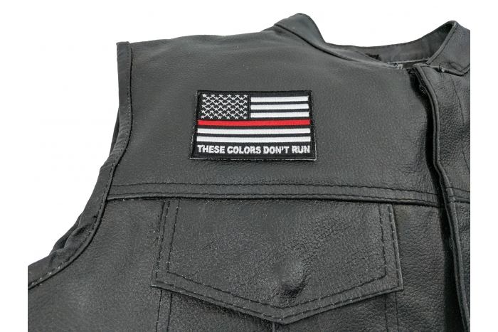 These Colors Don't Run Red Line US Flag Patch - 3x2 inch. Embroidered Iron on Patch shown on leather vest