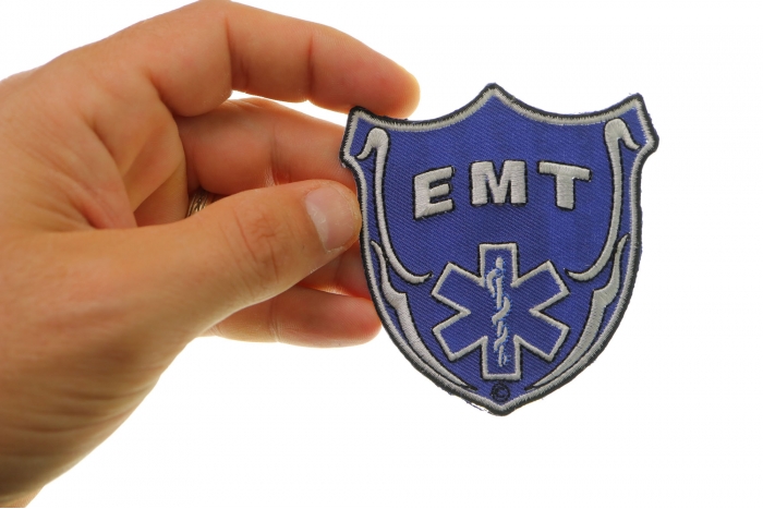 Emt Shield Patch shown on hand for size comparison