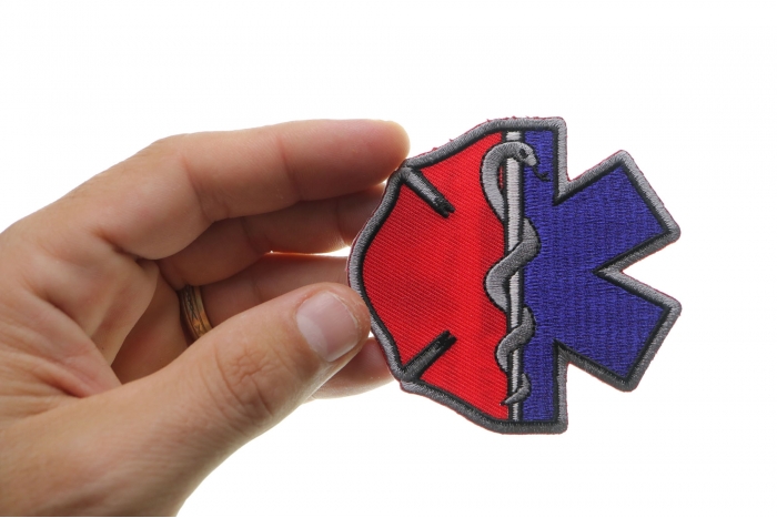 Firefighter EMT Emblems Patch shown on hand for size comparison