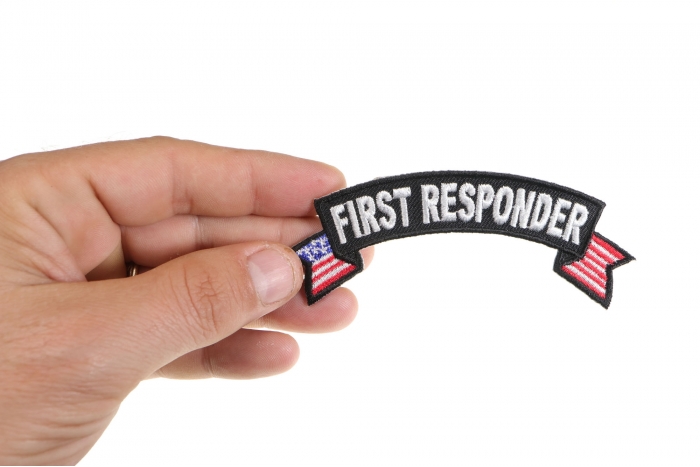 First Responder US Flag Small Rocker Patch shown on hand for size comparison