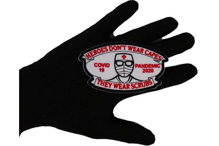 Heroes don't wear capes they wear scrubs Covid 19 Pandemic Patch shown on hand for size comparison