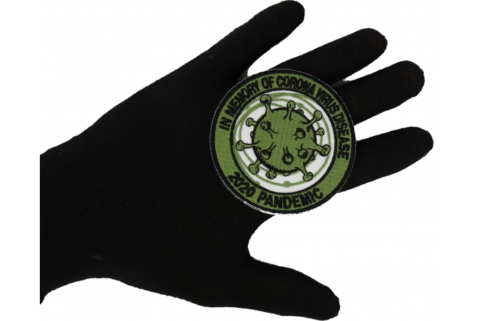 In memory of Corona Virus Disease 2020 Pandemic Iron on Patch shown on hand for size comparison