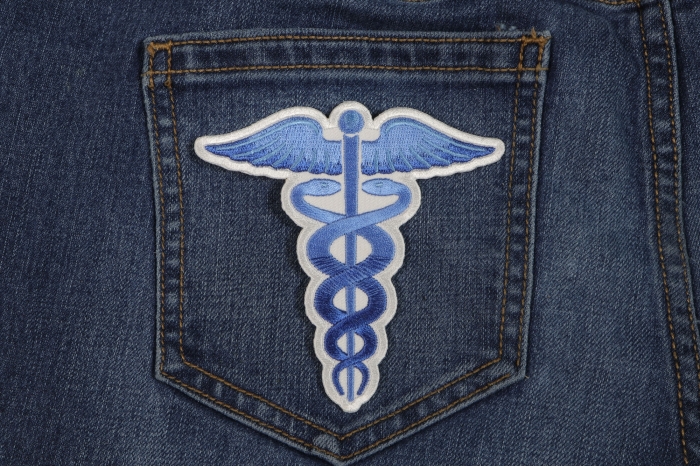 Medic Symbol Iron on Patch Blue shown on jeans