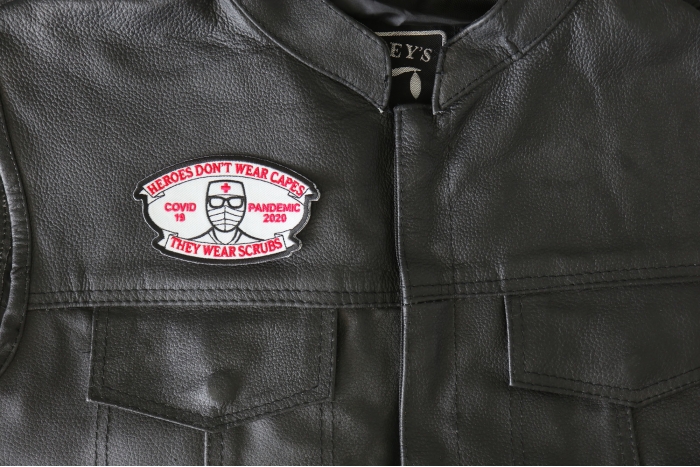 Heroes don't wear capes they wear scrubs Covid 19 Pandemic Patch - 4x2.4 inch - Embroidered Iron on Patch shown on leather vest