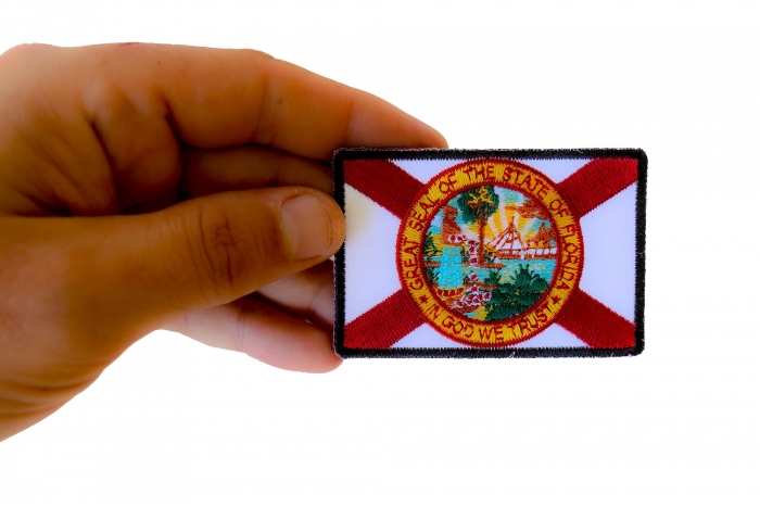 Florida Flag Patch shown on hand for size comparison