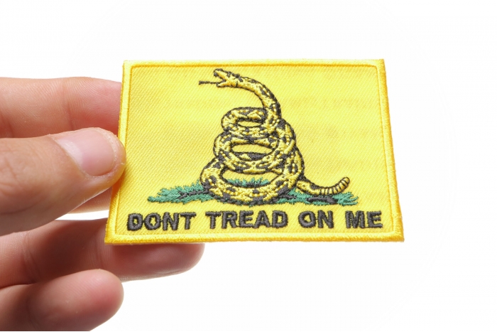 Gadsden Flag Don't Tread On Me Patch shown on hand for size comparison