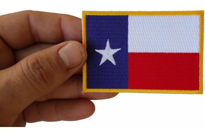 Gold Border Texas Flag Patch shown on hand for size comparison