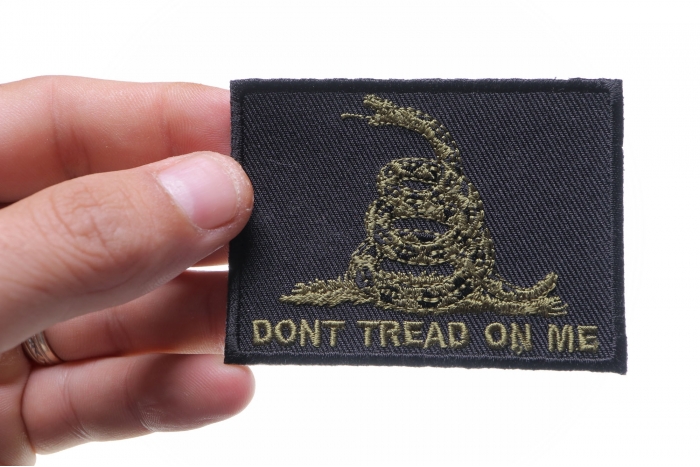 Green Black Gadsden Flag Don't Tread on Me Patch shown on hand for size comparison